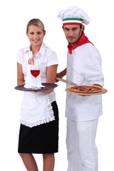Pizza chef standing next to a wine waitress