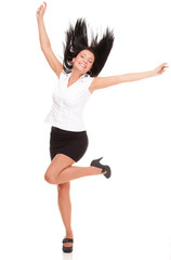 A joyous young female business executive celebrating success rai