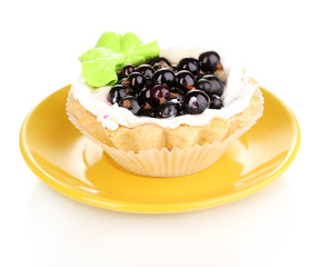 sweet cake with berries on saucer isolated on white