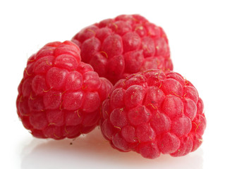 ripe raspberries isolated on white
