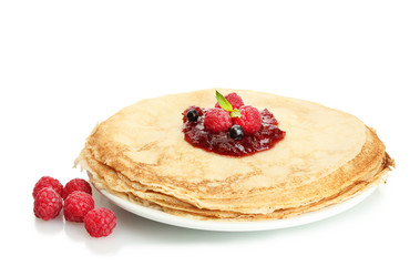 Delicious pancakes with berries and jam