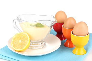 Mayonnaise in bowl on napkin isolated on white