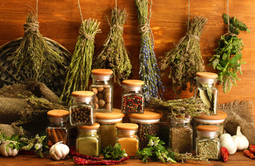 Plakaty  dried herbs, spices and and pepper, on wooden background