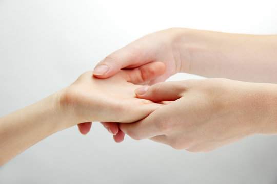 Hand massage, on grey background