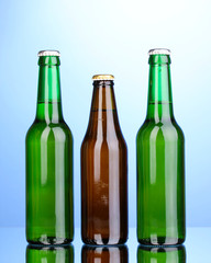 bottles of beer on blue background