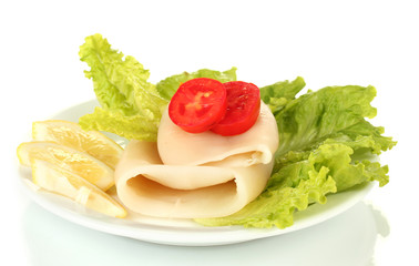 boiled squids with vegetables on the plate isolated on white