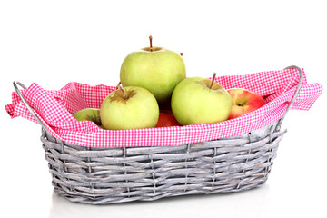 Ripe apples in basket isolated on white