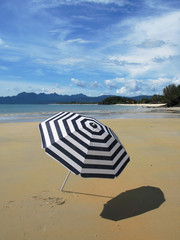 Striped umbrella on the beach of Langkawi island, Malaysia