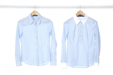 Pair woman shirt on a hanger studio isolated