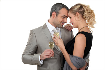 Couple dancing with glasses of champagne