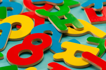 Colored wooden numbers and letters for children