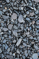 Wet waterworn pebbles