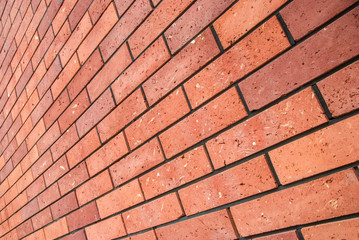 angle view red brick wall, square format