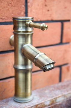 old style brass water tap