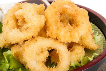 Deep batter fried squid rings calamari with green salad