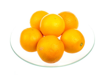 Heap of oranges in the dish