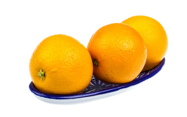 Heap of oranges in the dish