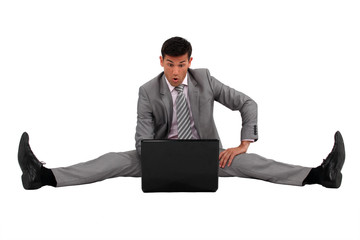 Man sitting on the floor with his laptop
