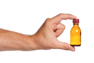 Hand with small bottle