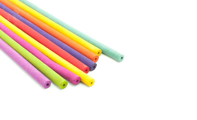 Incense aroma sticks closeup on white background.
