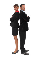 Businessman and businesswoman standing back-to-back