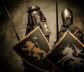 Medieval knights on grey background - obrazy, fototapety, plakaty