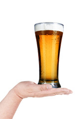 Glass of beer on man's hand