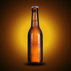 bottle of beer on yellow background