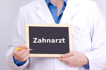Doctor shows information on blackboard: dentist