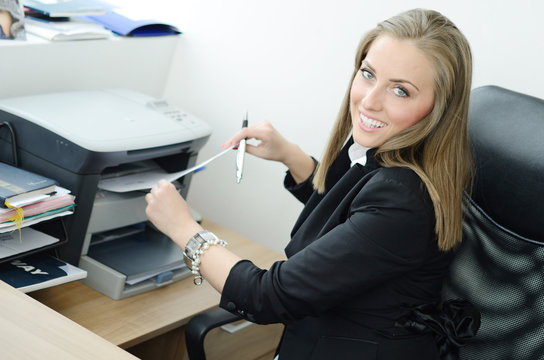 Pretty blondy smiling and printing