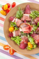 Speck on pear in red wine