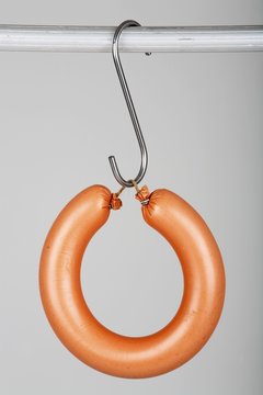 A ringwurst (Lyoner) on a hook