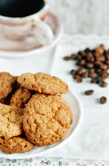 Cookies, cup of coffee and coffee beans
