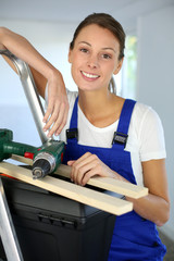 Cheerful young woman ready to reform house
