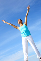 woman doing yoga exercises in countryside