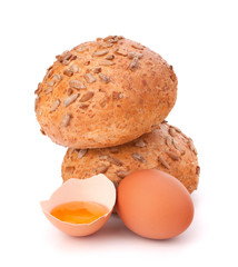 Bun with seeds and broken egg