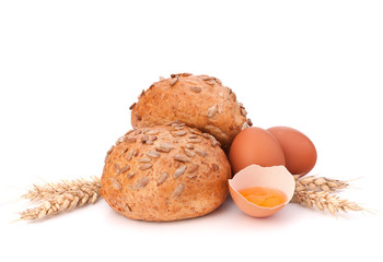 Bun with seeds and broken egg