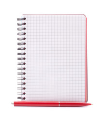 Open blank checked notebook with red pen