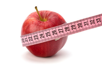 Apple with tape measure. Healthy lifestyle concept.
