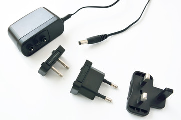 Black electrical adapters on a white background