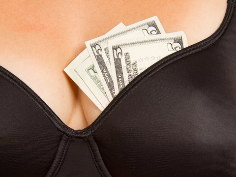 Concept - woman with cash in a bra