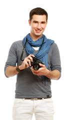 A portrait of a young photographer with a camera