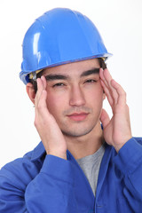 Builder suffering from headache