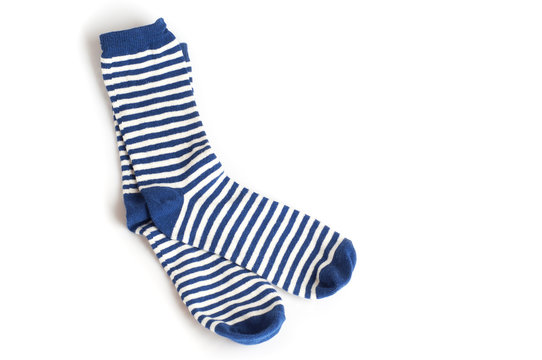 Two blue and white striped socks on white background