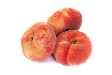 Three ripe fig peach on white