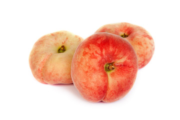 Three ripe fig peach on white
