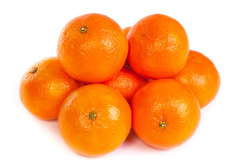 Group of ripe tangerine or mandarin with slices on white