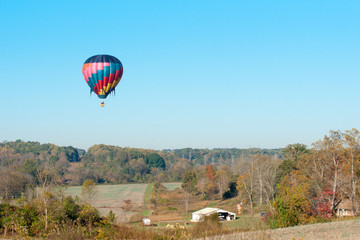 hot air balloon over farm land