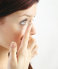 Fototapeta premium young woman with contact lense