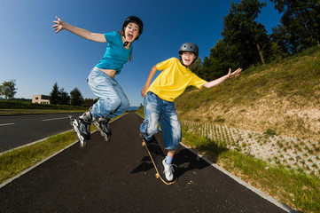 Active young people - rollerblading, running © Jacek Chabraszewski
